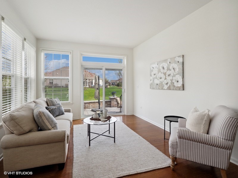 2940 Chevy Chase Lane Naperville, IL 60564 - Photo 11 of 38 a living room with furniture and a large window