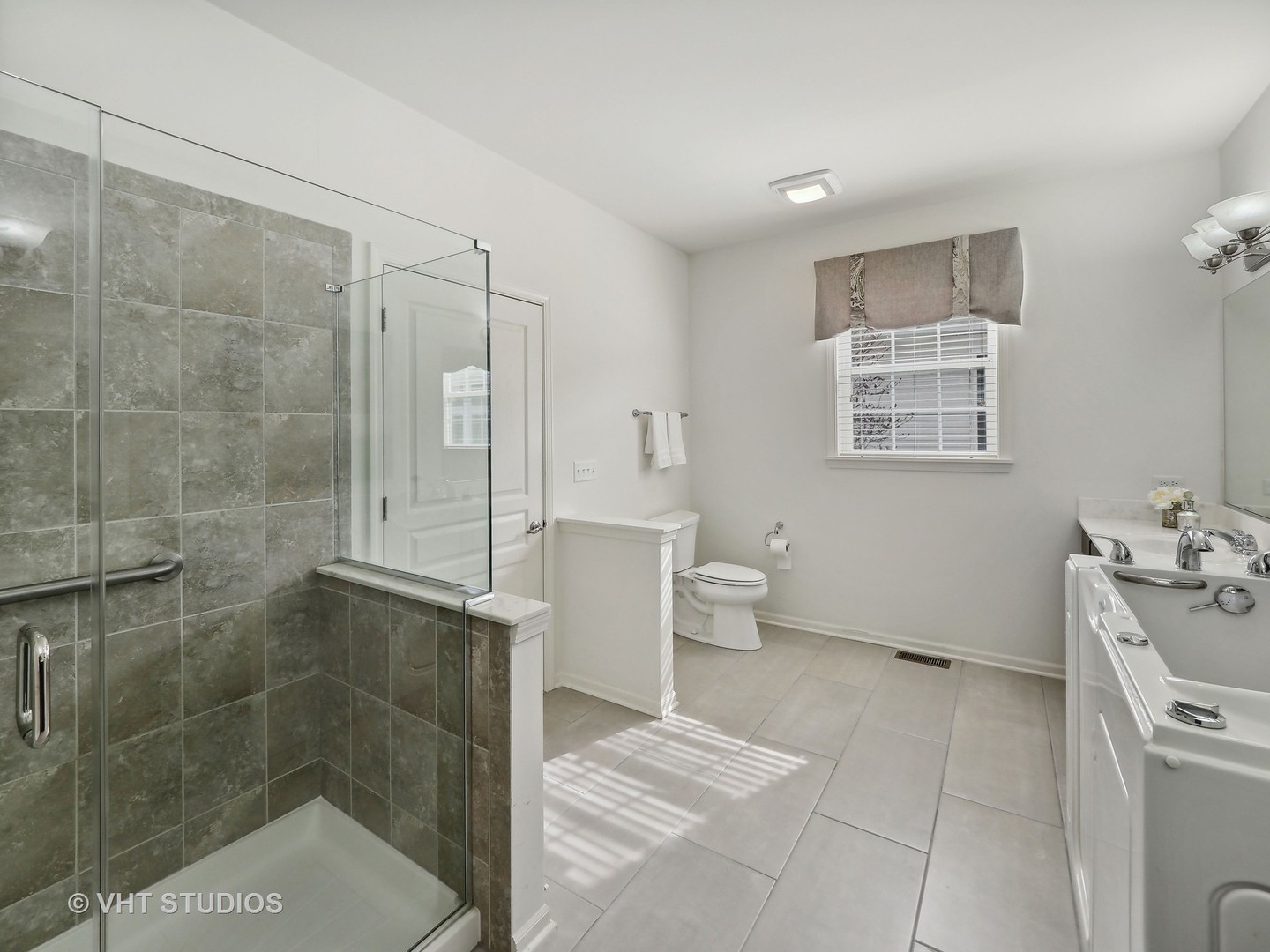 2940 Chevy Chase Lane Naperville, IL 60564 - Photo 13 of 38 a spacious bathroom with a shower and a toilet