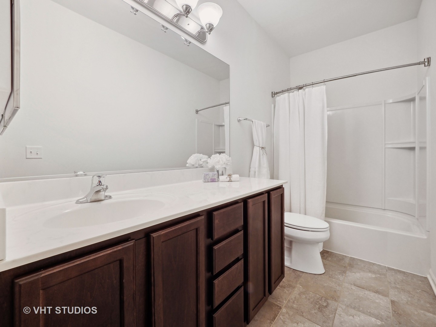 2940 Chevy Chase Lane Naperville, IL 60564 - Photo 16 of 38 a bathroom with a sink a toilet and shower