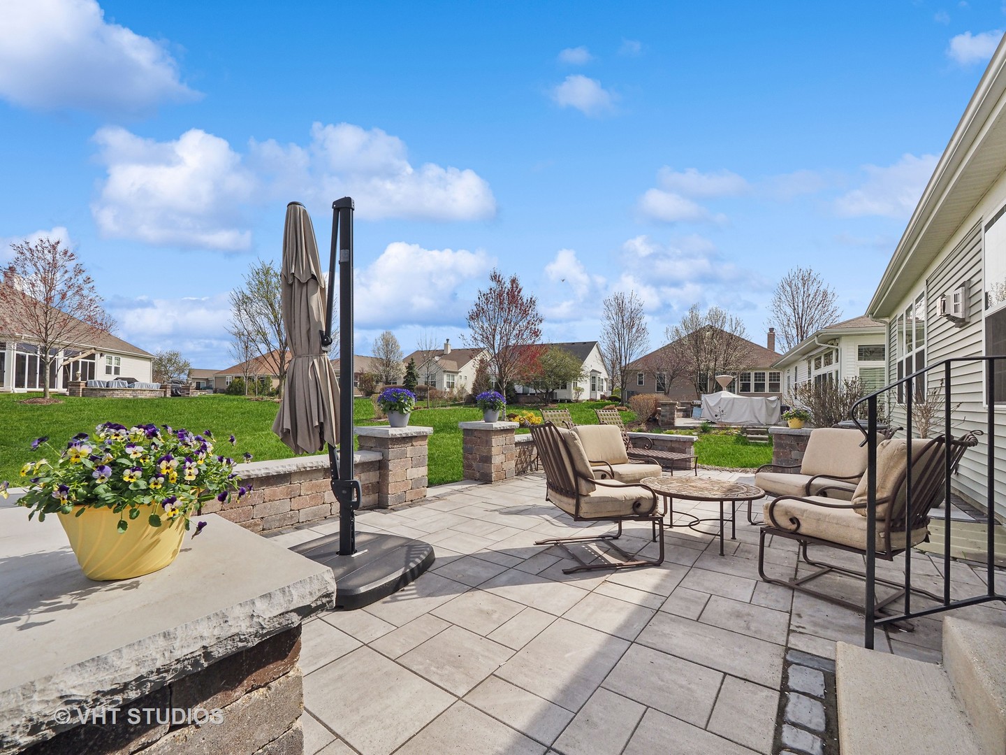 2940 Chevy Chase Lane Naperville, IL 60564 - Photo 20 of 38 a view of a patio with a table and chairs