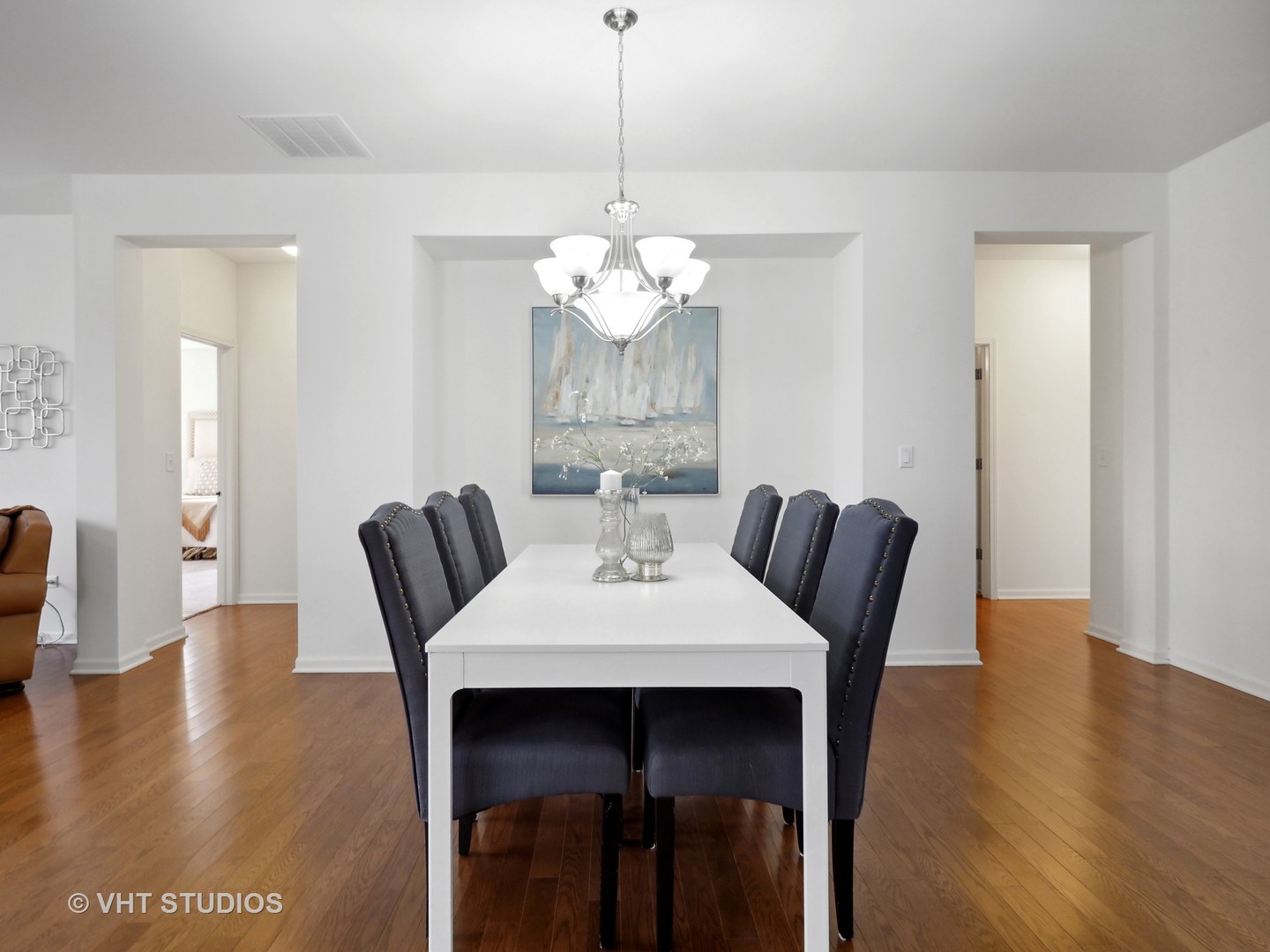 2940 Chevy Chase Lane Naperville, IL 60564 - Photo 5 of 38 a view of a dining room with furniture wooden floor and chandelier
