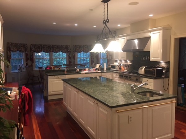 45 Arnold Road Wellesley, MA 02481 - Photo 12 of 15 a kitchen with stainless steel appliances granite countertop a sink a counter space appliances and cabinets