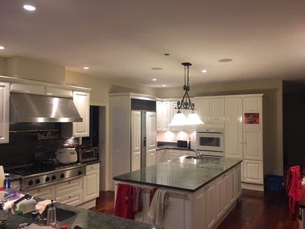 45 Arnold Road Wellesley, MA 02481 - Photo 14 of 15 a kitchen with stainless steel appliances granite countertop a sink refrigerator and microwave