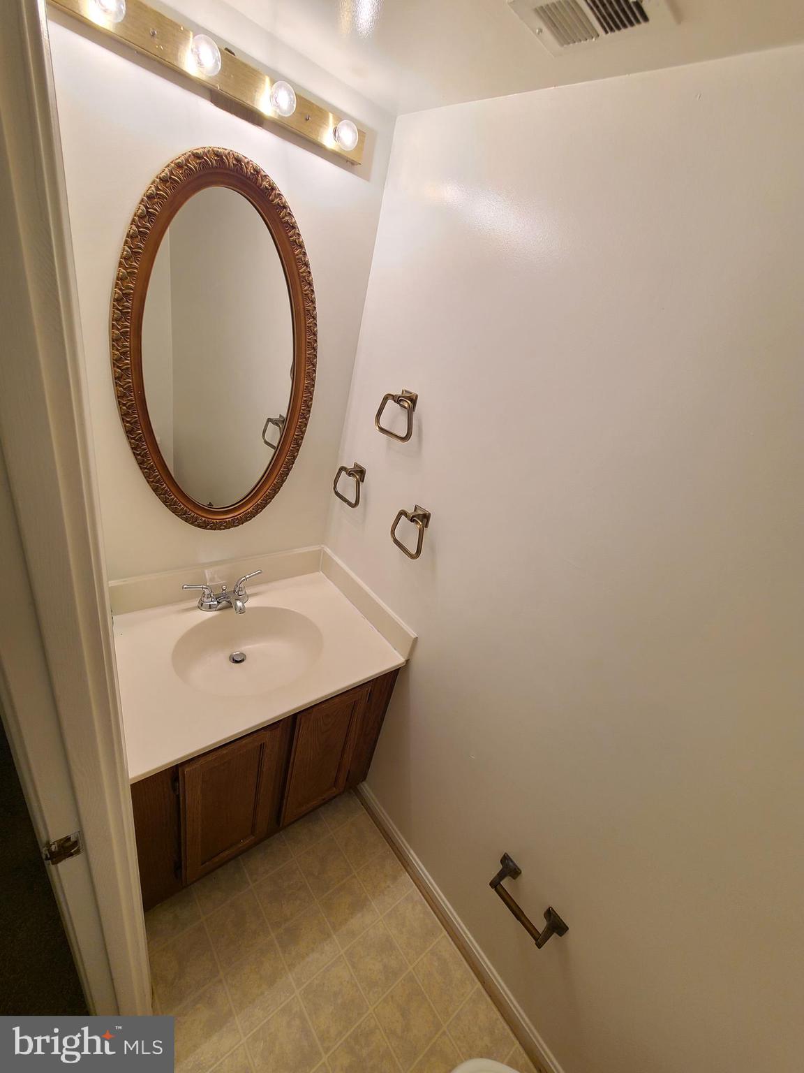 1427 Casino Circle Silver Spring, MD 20906 - Photo 12 of 34 a bathroom with a sink and a mirror