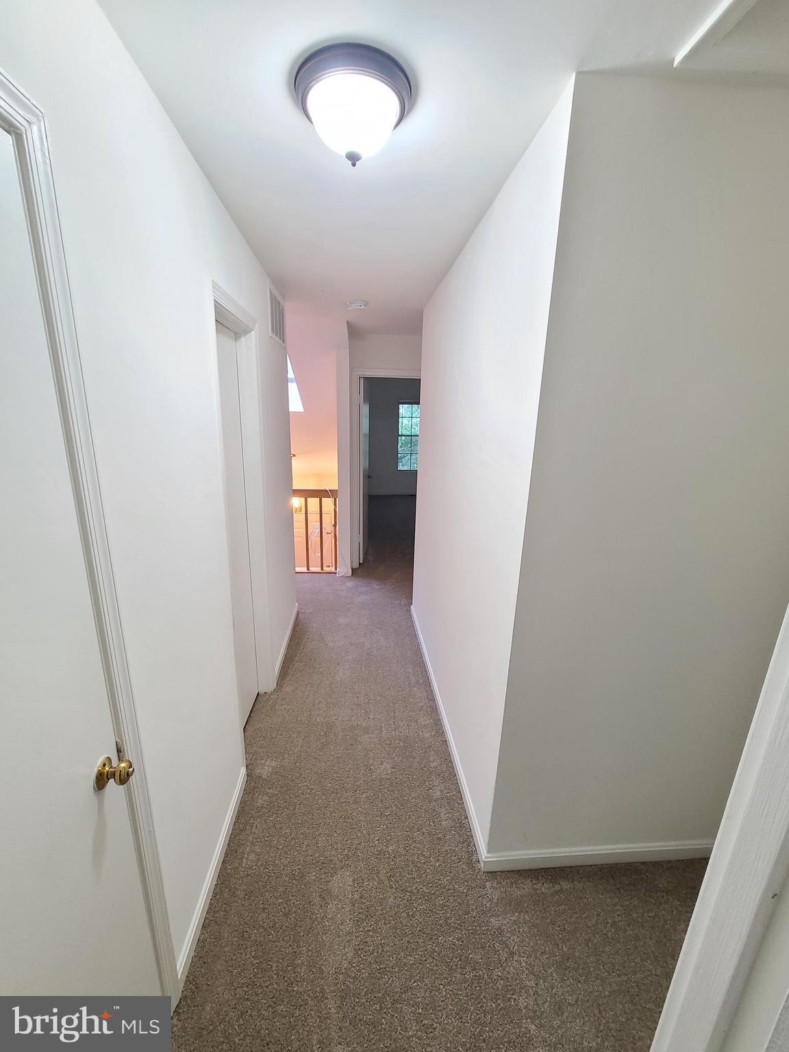 1427 Casino Circle Silver Spring, MD 20906 - Photo 14 of 34 a view of a hallway with a white walls