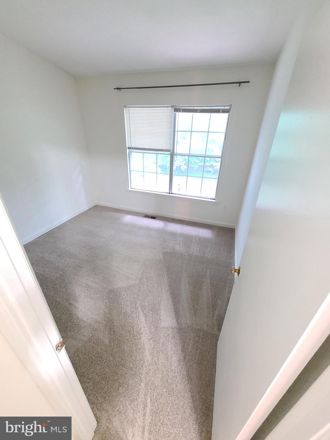 1427 Casino Circle Silver Spring, MD 20906 - Photo 17 of 34 a view of an empty room with a window