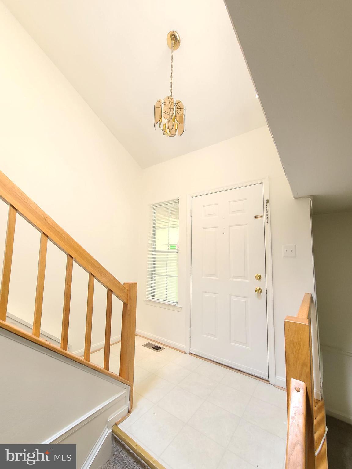 1427 Casino Circle Silver Spring, MD 20906 - Photo 2 of 34 a view of a hallway with wooden floor and staircase