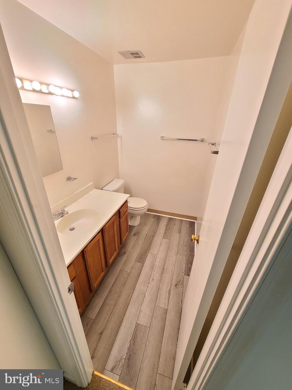 1427 Casino Circle Silver Spring, MD 20906 - Photo 30 of 34 a bathroom with a sink a toilet a mirror and shower