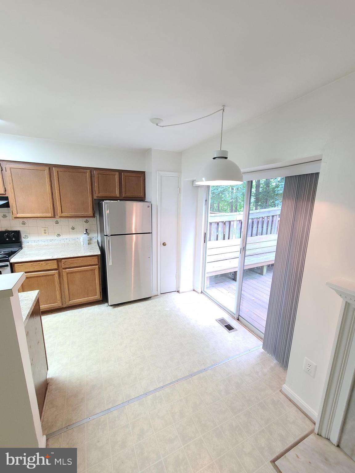 1427 Casino Circle Silver Spring, MD 20906 - Photo 9 of 34 a bedroom with a bed and a large window