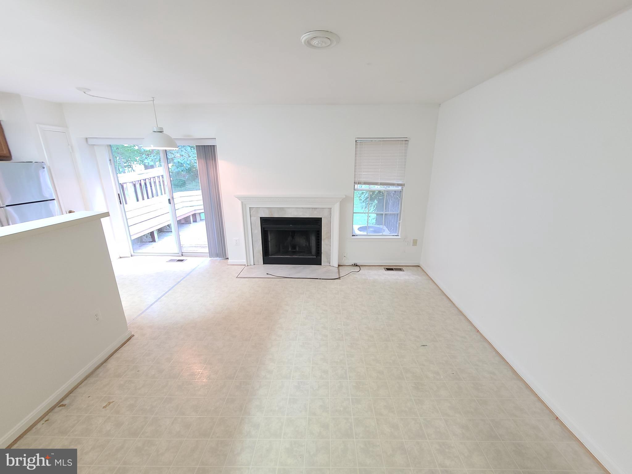 1427 Casino Circle Silver Spring, MD 20906 - Photo 10 of 34 a living room with furniture and a fireplace