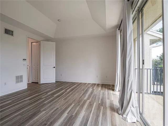 a bath tub sitting next to a window