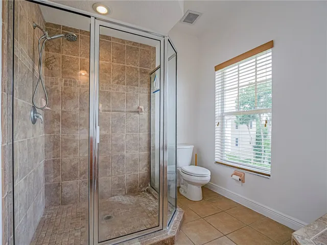 a view of hallway with windows