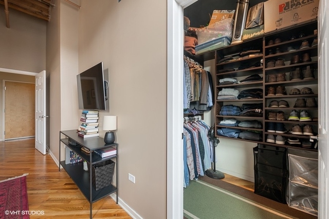 1040 West Adams Street, Unit 610 Chicago, IL 60607 - Photo 12 of 24 a view of walk in closet with clothes and shoes