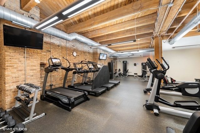 1040 West Adams Street, Unit 610 Chicago, IL 60607 - Photo 21 of 24 a view of a room with gym equipment
