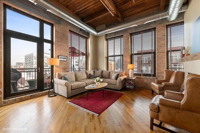 1040 West Adams Street, Unit 610 Chicago, IL 60607 - Photo 4 of 24 a living room with furniture and a large window