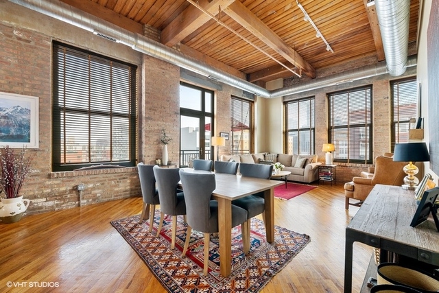 1040 West Adams Street, Unit 610 Chicago, IL 60607 - Photo 9 of 24 a view of a dining room with furniture window and outside view