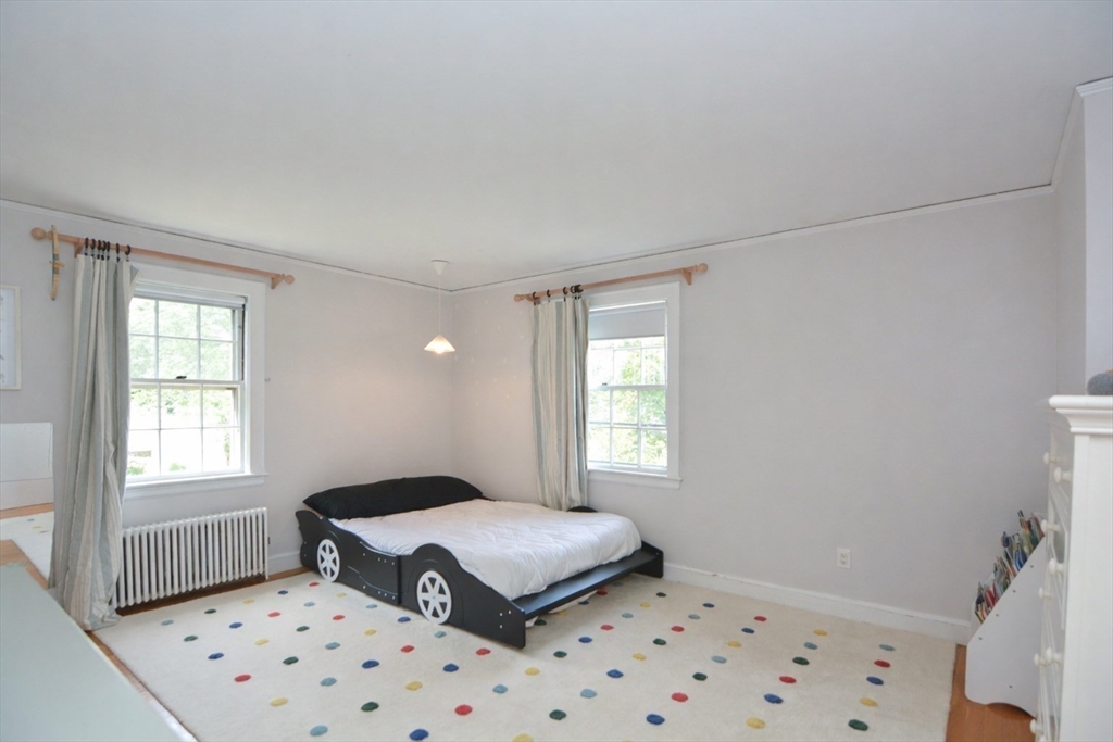 10 Radcliffe Road Belmont, MA 02478 - Photo 13 of 19 a bedroom with a bed and a window