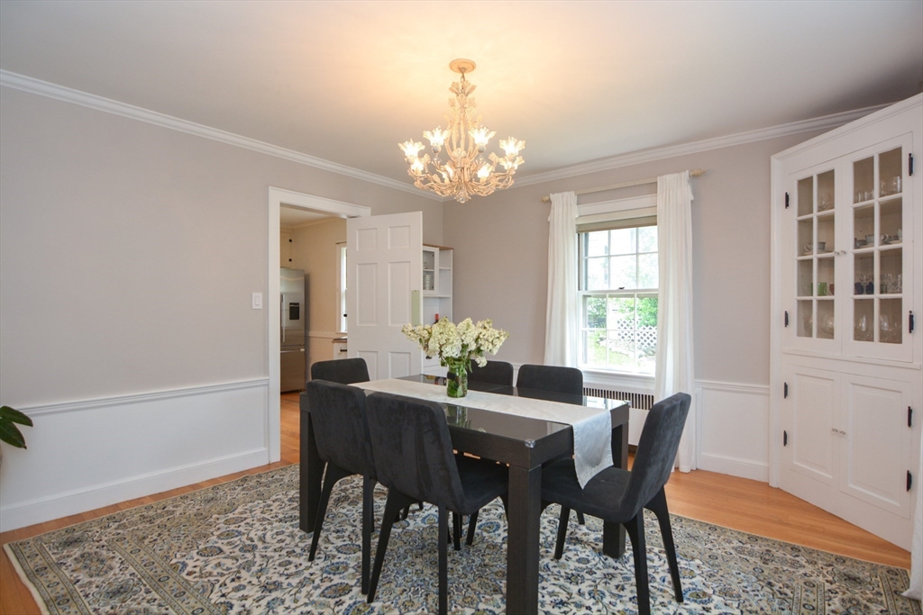 10 Radcliffe Road Belmont, MA 02478 - Photo 7 of 19 a view of a dining room with furniture and chandelier