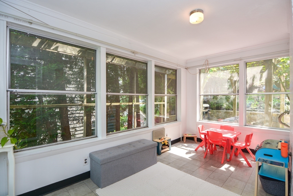 10 Radcliffe Road Belmont, MA 02478 - Photo 9 of 19 a living room filled with furniture and floor to ceiling windows