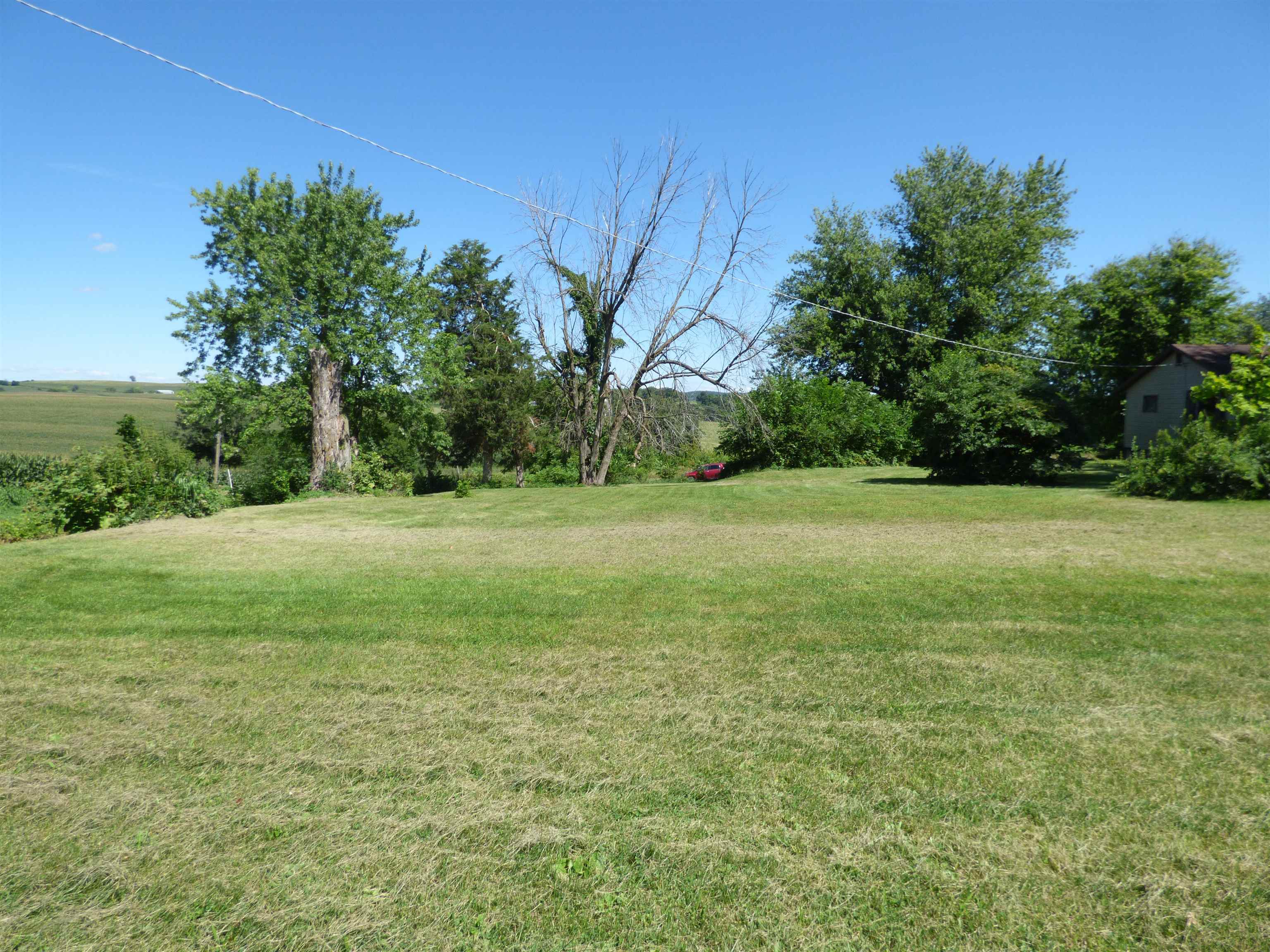 10203 East Center Road Stockton, IL 61085 - Photo 24 of 33 a view of a field with trees in the background