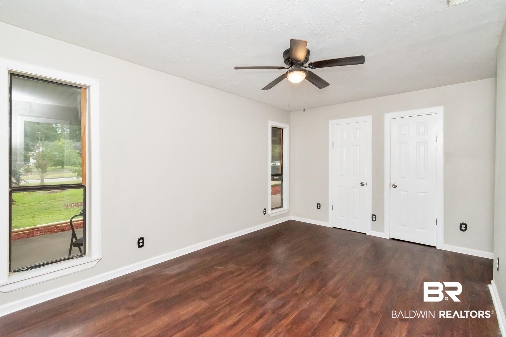 15060 Starlight Avenue Wilmer, AL 36587 - Photo 7 of 12 Spare room featuring ceiling fan and hardwood / wood-style floors