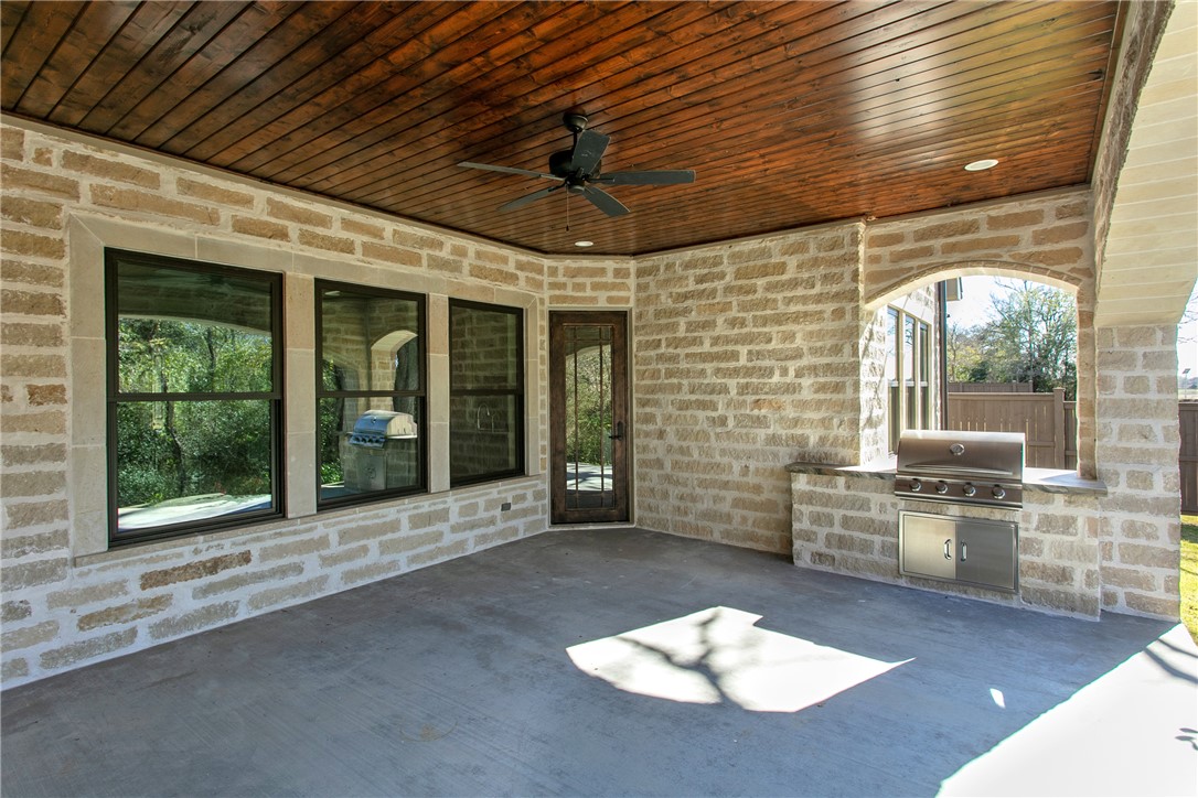 3317 Legacy Court Bryan, TX 77802 - Photo 24 of 28 expansive covered patio with outdoor kitchen