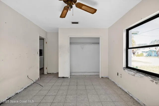 a view of a kitchen from a corridor