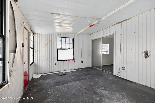 an empty room with windows