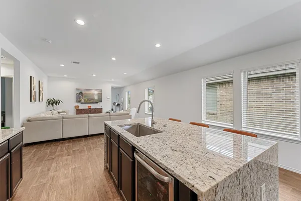 a kitchen with granite countertop white cabinets and counter space