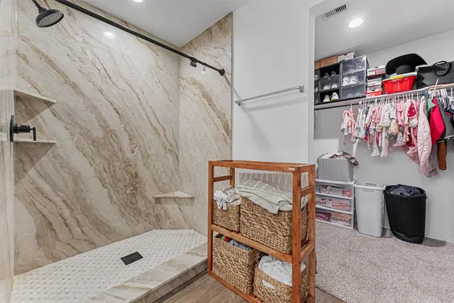 a bathroom with a tub and a shower