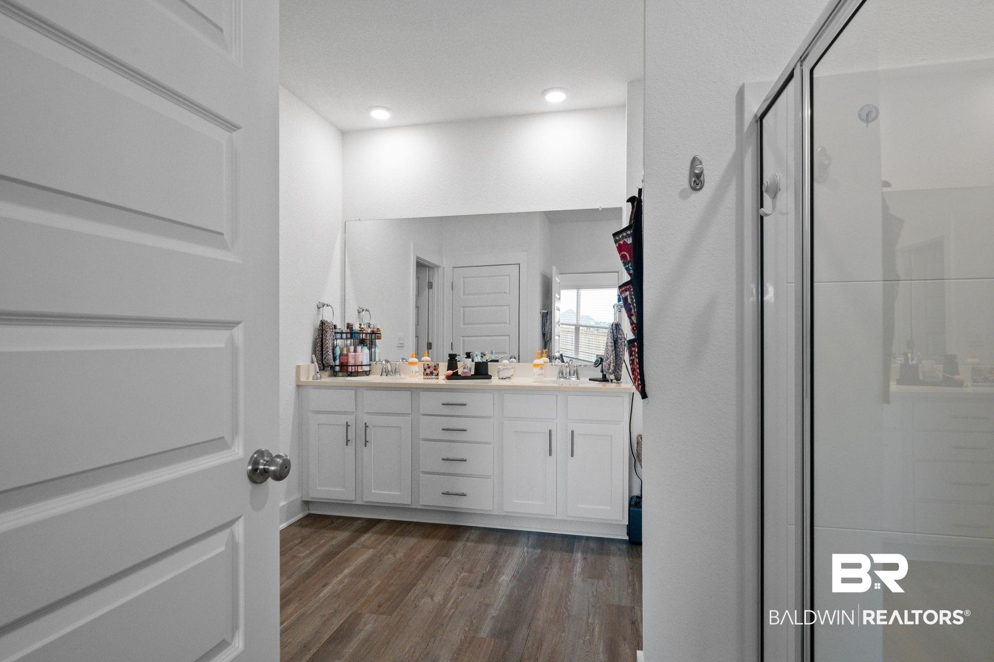 8508 Rosedown Lane Daphne, AL 36526 - Photo 20 of 29 Bathroom featuring a stall shower, dark wood finished floors, and double vanity