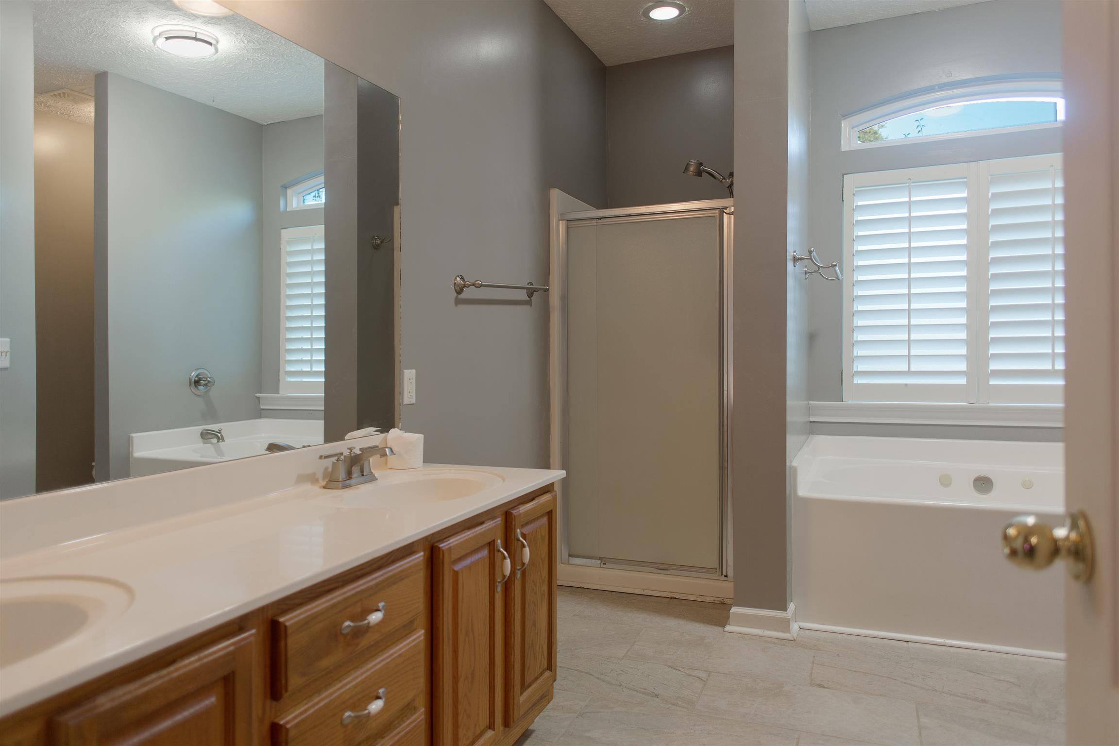 master has double vanities and a separate tub/shower