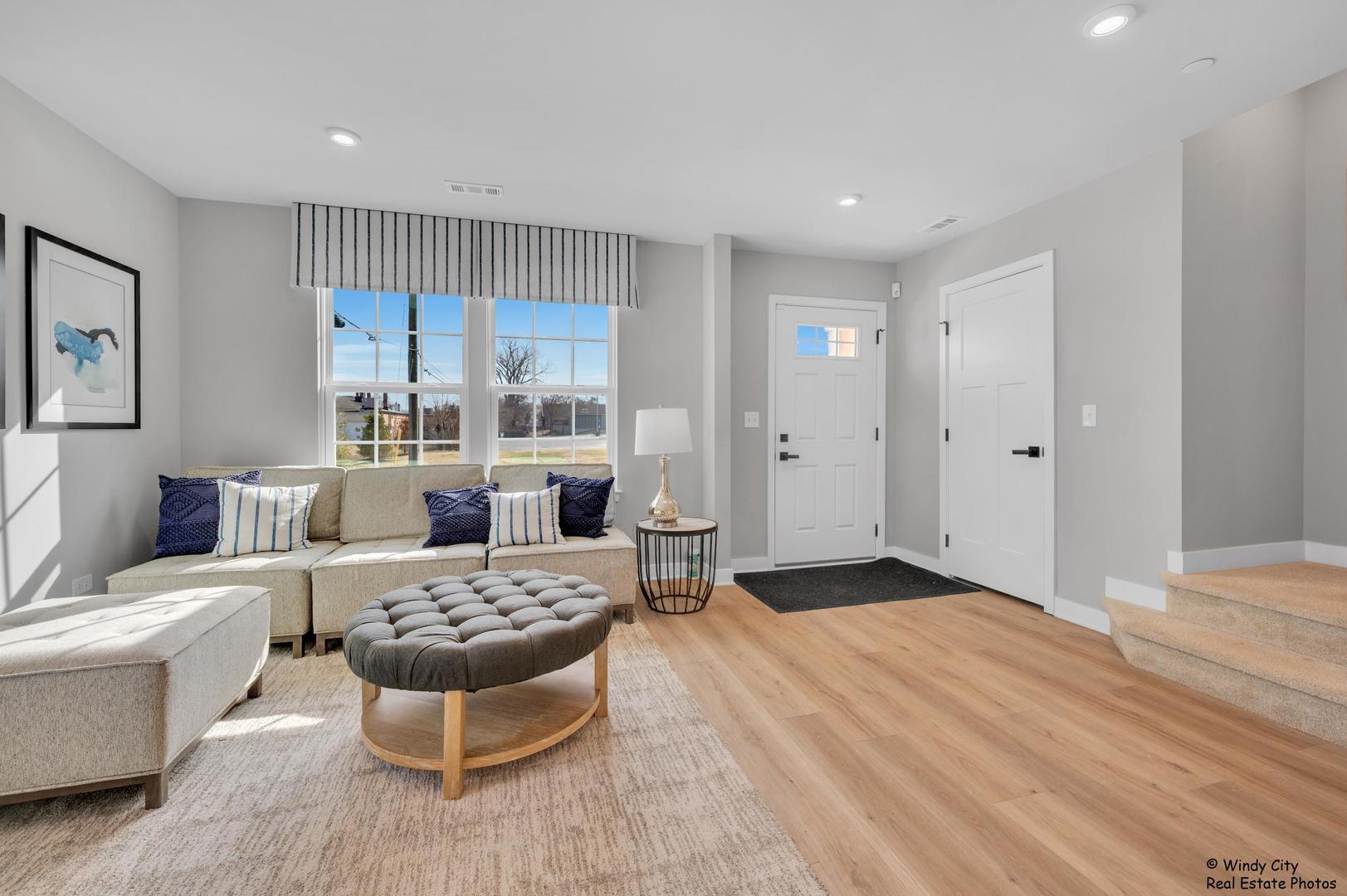 908 Jenkins Court Wheeling, IL 60090 - Photo 11 of 20 a living room with furniture and a large window