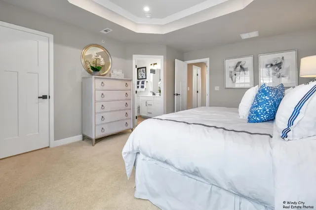 a bedroom with a bed and a table in it