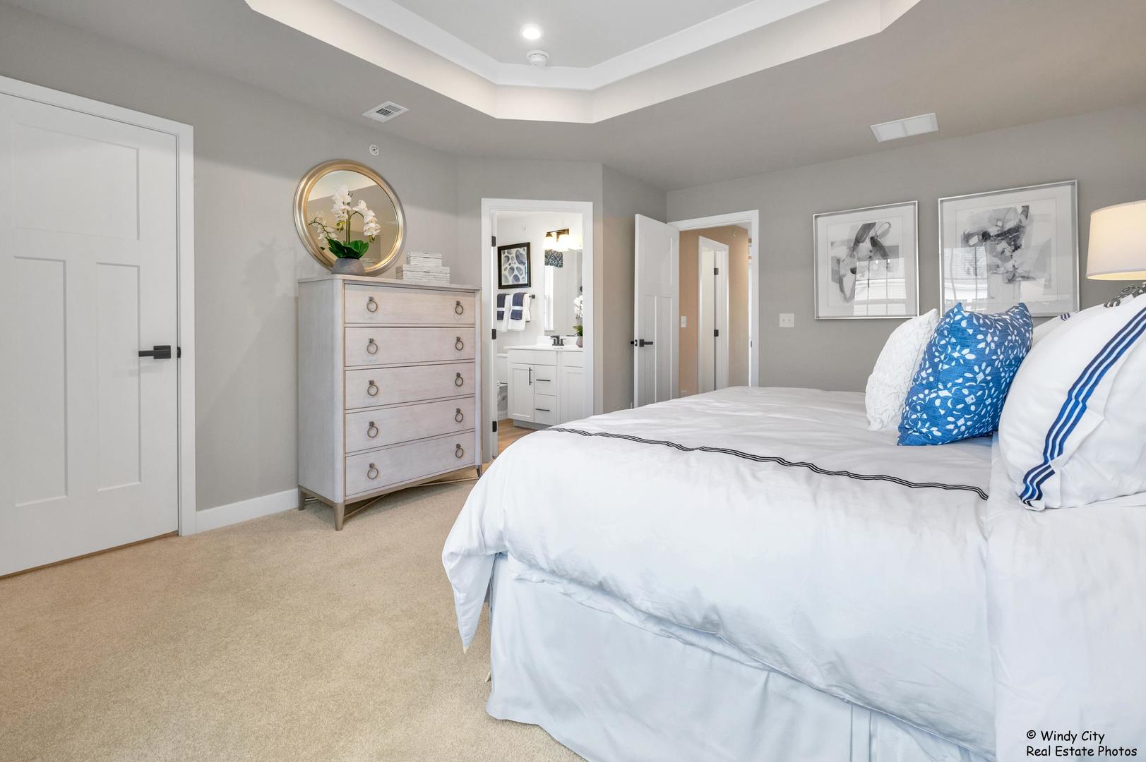 908 Jenkins Court Wheeling, IL 60090 - Photo 14 of 20 a bedroom with a bed and a table in it