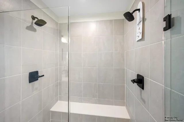 a bathroom with a shower and a bathtub