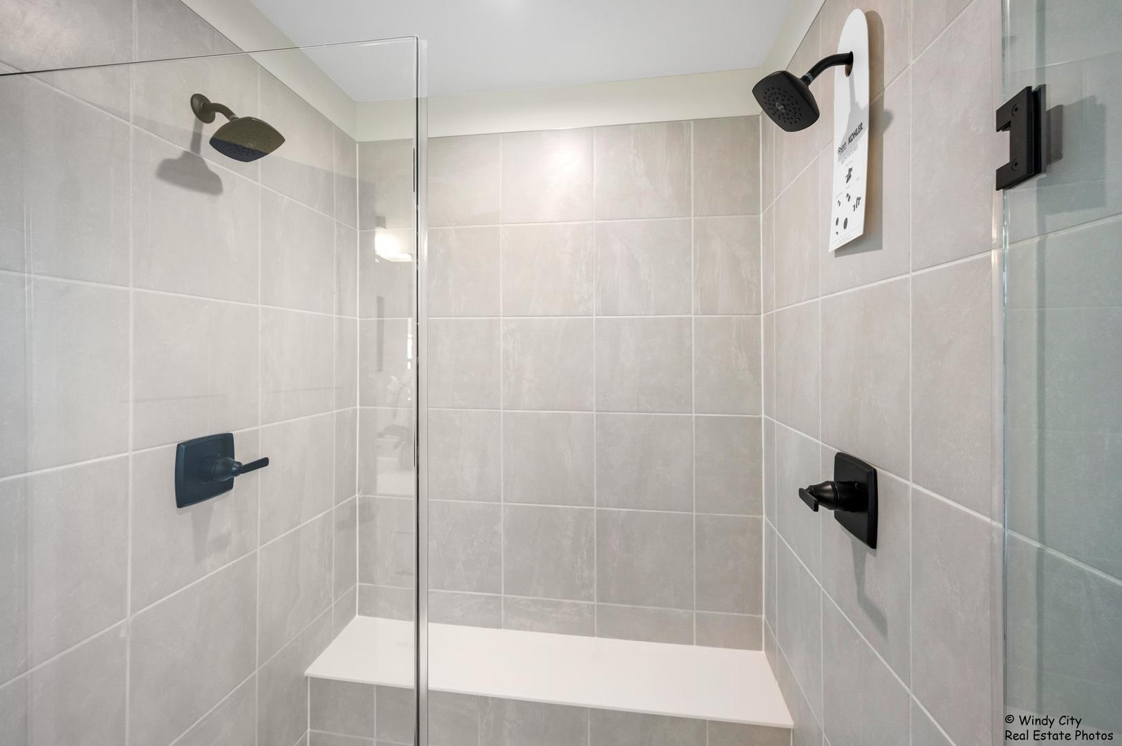 908 Jenkins Court Wheeling, IL 60090 - Photo 17 of 20 a bathroom with a shower and a bathtub