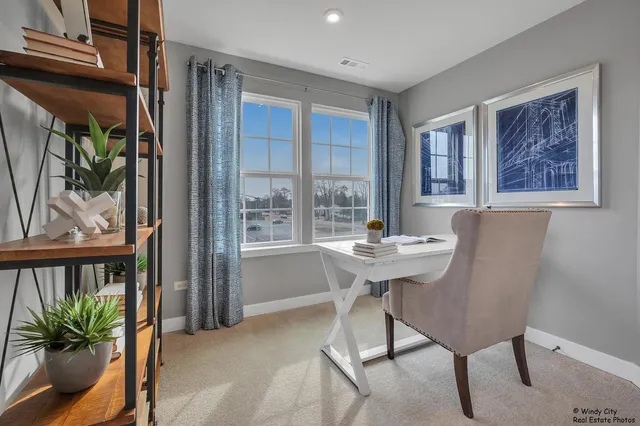 a view of a dining room with furniture window and outside view