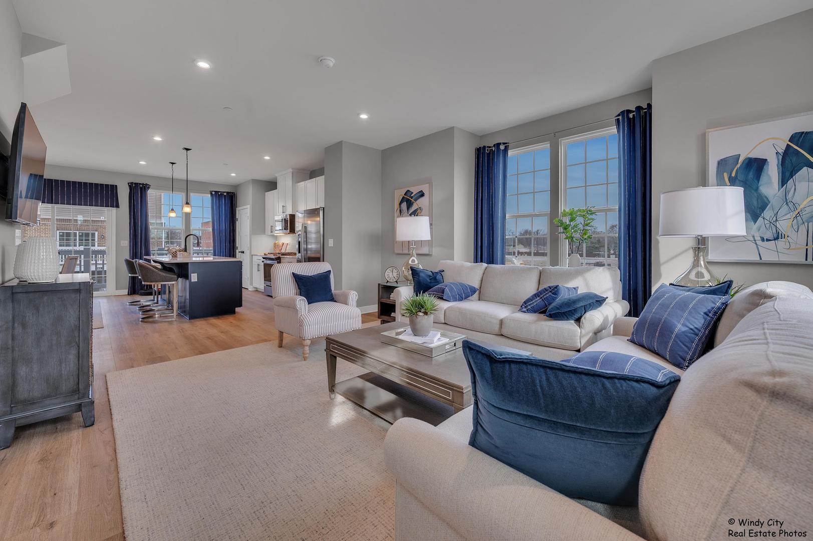 908 Jenkins Court Wheeling, IL 60090 - Photo 6 of 20 a living room with furniture and a large window