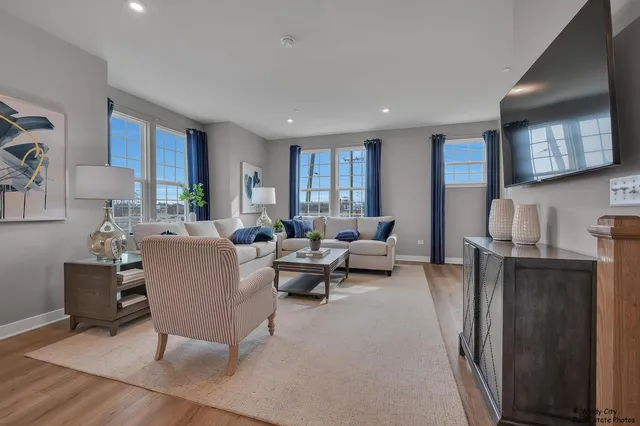 a living room with fireplace furniture and a flat screen tv