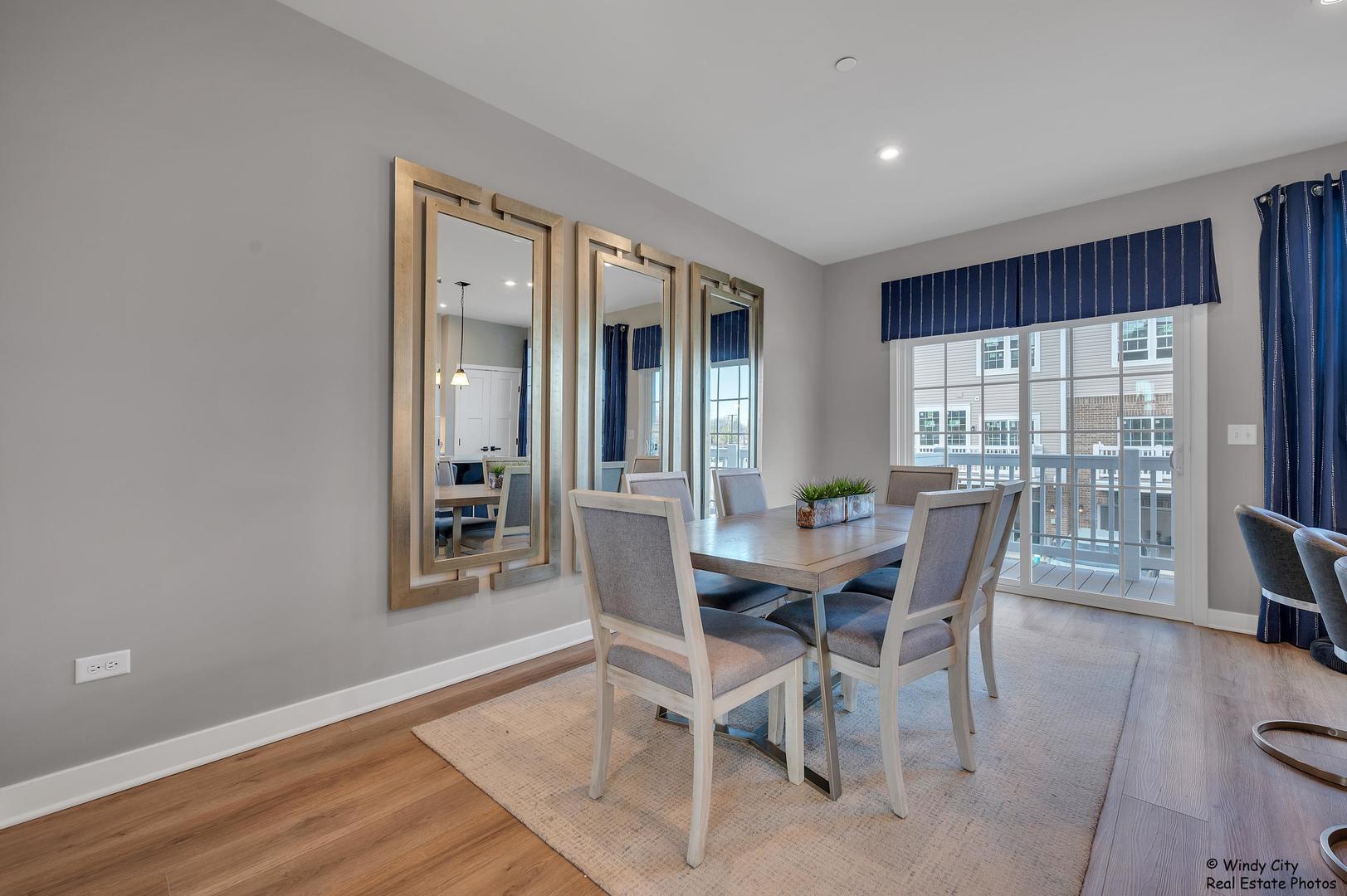 908 Jenkins Court Wheeling, IL 60090 - Photo 9 of 20 a view of a dining room with furniture and wooden floor