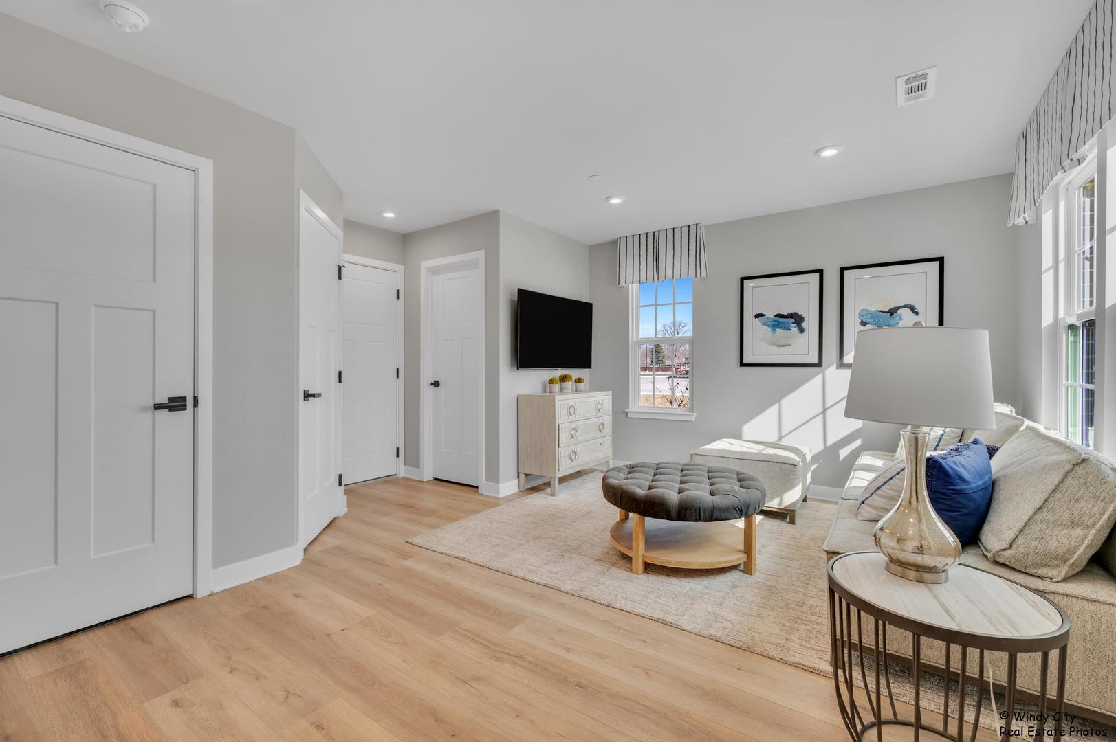 908 Jenkins Court Wheeling, IL 60090 - Photo 10 of 20 a living room with furniture and a flat screen tv