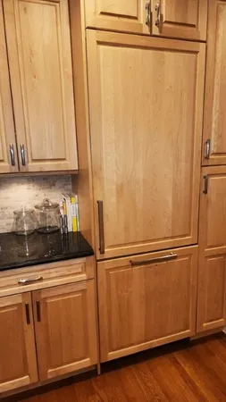 a kitchen with wooden floors and a sink