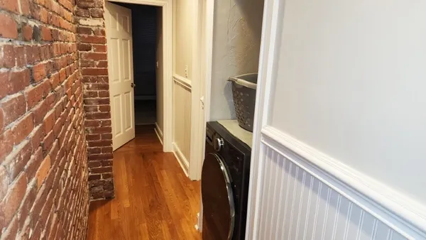 a white toilet sitting next to a bath tub shower