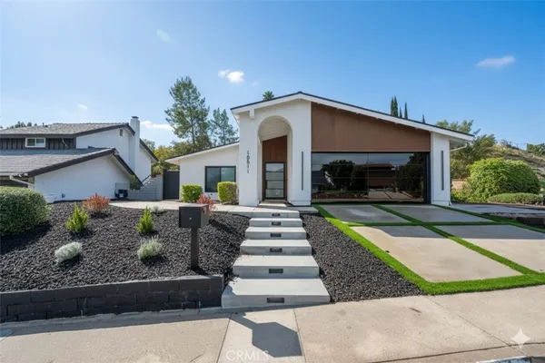 a front view of a house with garage