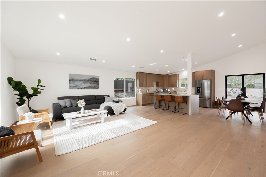 18511 Dylan Street Porter Ranch, CA 91326 - Photo 2 of 22 a living room with furniture and a table