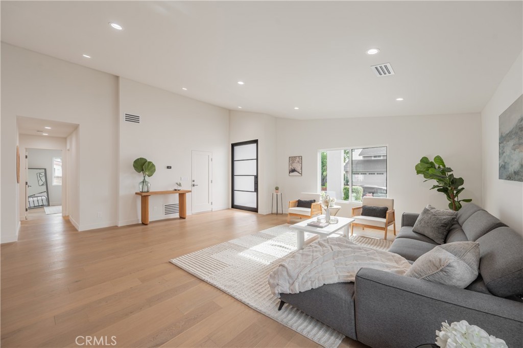 18511 Dylan Street Porter Ranch, CA 91326 - Photo 4 of 22 a living room with furniture and wooden floor