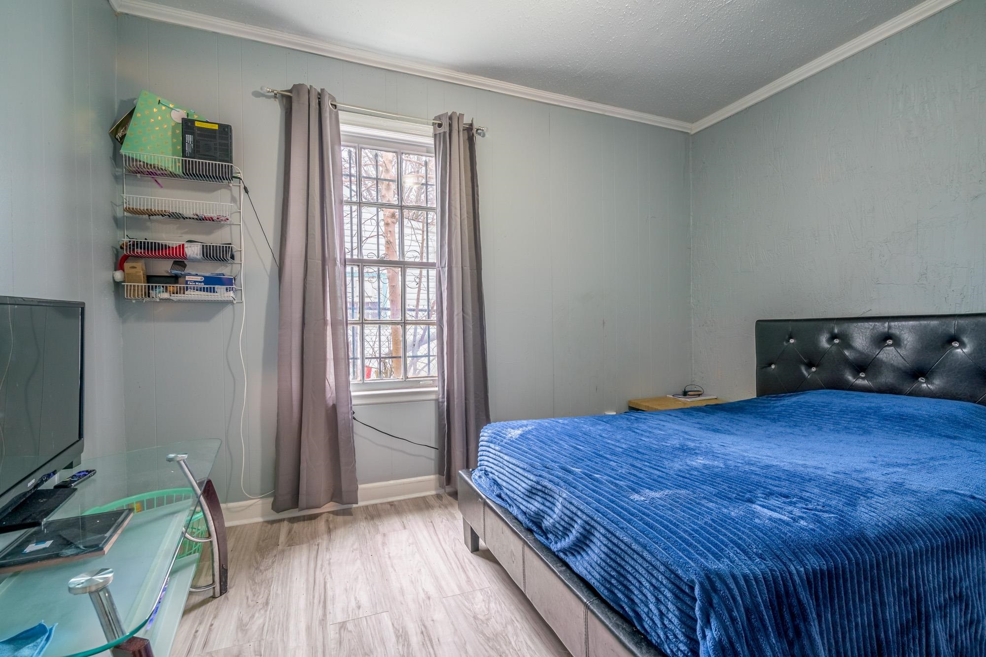 2941 North Radford Road Memphis, TN 38114 - Photo 14 of 25 a bedroom with a bed and a window