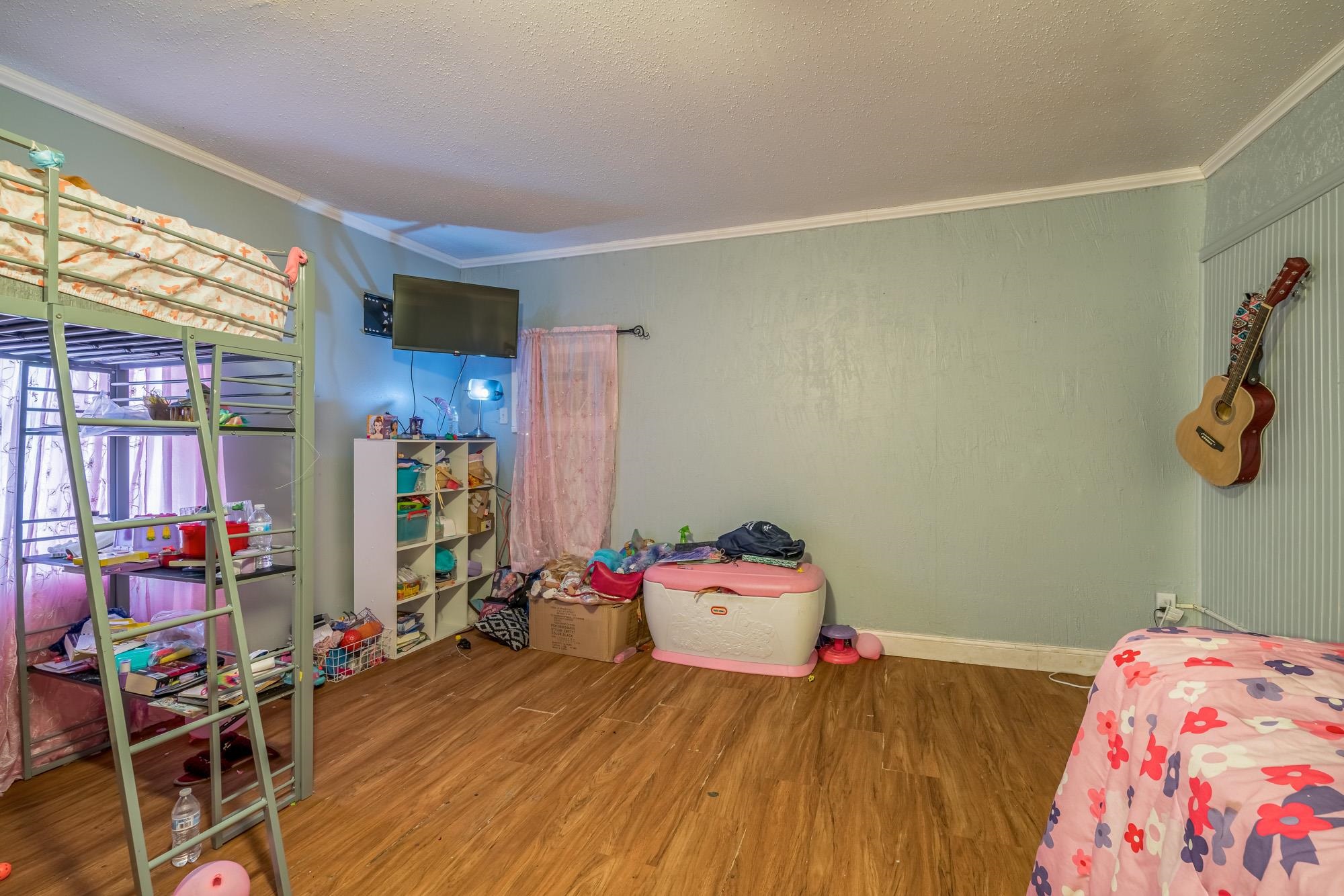 2941 North Radford Road Memphis, TN 38114 - Photo 17 of 25 a bedroom with a bed and a window