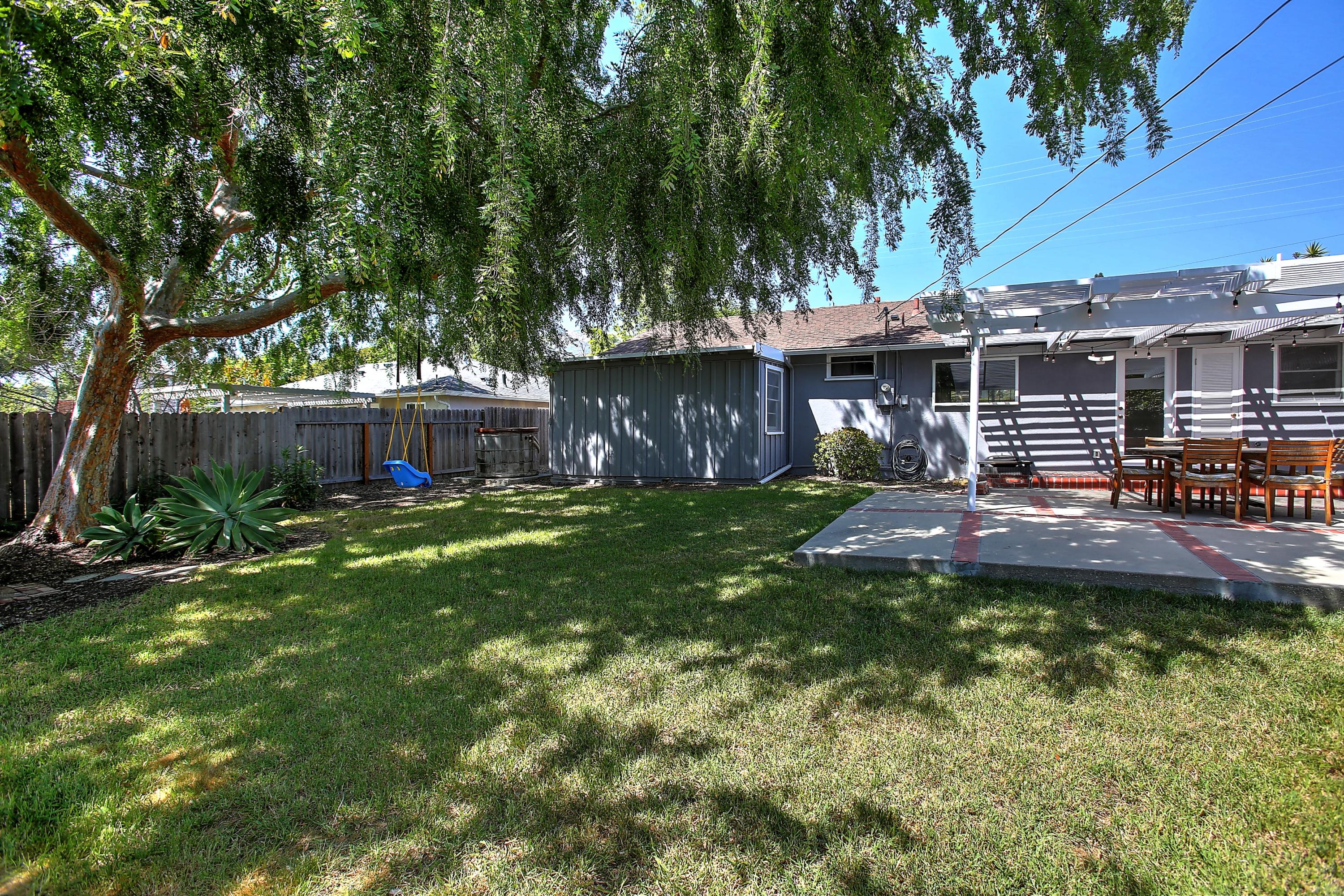 3041 Foothill Road Santa Barbara, CA 93105 - Photo 21 of 25 a front view of a house with a yard table and chairs